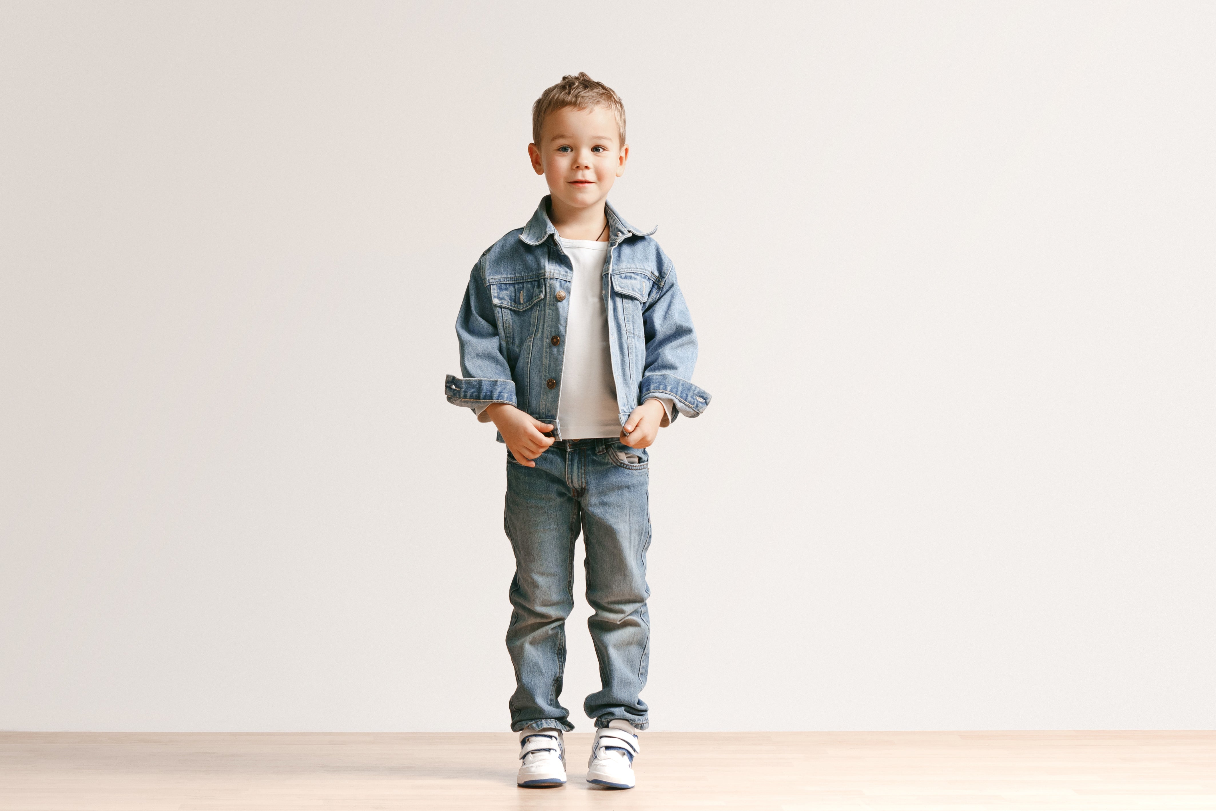 files/portrait-cute-little-kid-boy-stylish-jeans-clothes-looking-camera-against-white-studio-wall.jpg